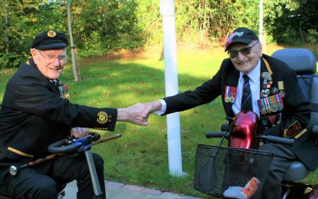 Two veterans shaking hands.