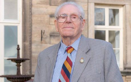 Veteran Tom Brown outside Rothbury House.