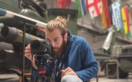 BFBS Academy student using a camera.