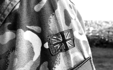 Close up of a soldier's uniform, union jack flag on the sleeve.