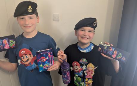 Two forces children with Super Mario merchandise
